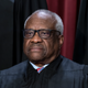 Associate Justice Clarence Thomas joins other members of the Supreme Court as they pose for a new group portrait, at the Supreme Court building in Washington, Oct. 7, 2022. Supreme Court Justice Clarence Thomas on Monday, Oct. 24, temporarily blocked Sen. Lindsey Graham’s testimony to a special grand jury investigating whether then-President Donald Trump and others illegally tried to influence the 2020 election in the state.